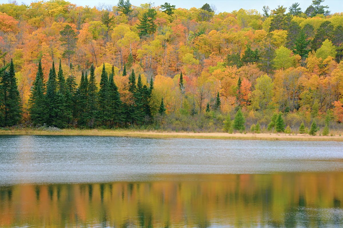 Autumn colors reflected off the calm lake